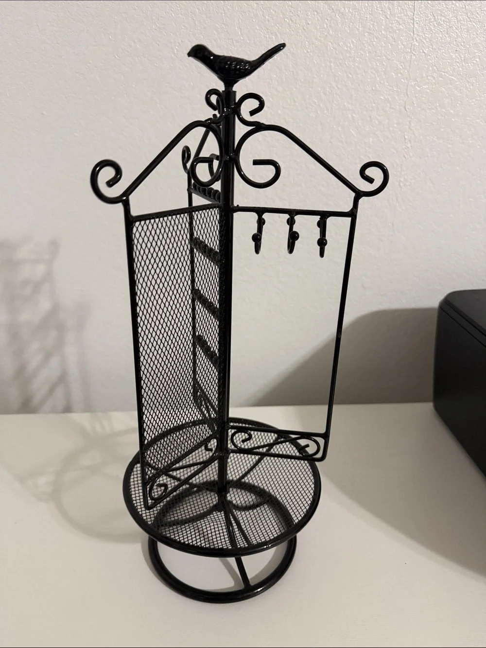 Rotating Black Metal Jewelry Organizer Stand with Bird Accent